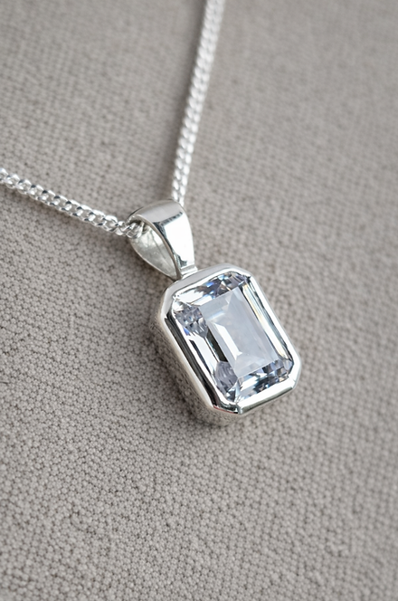 Secretly Set Emerald Pendant